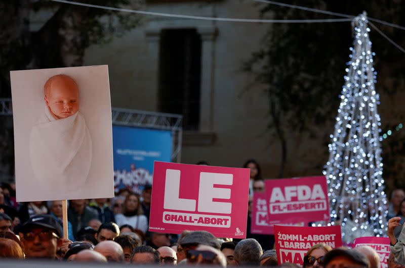 People protest against government plans to introduce an abortion law in Valletta