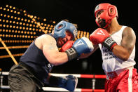 <p>Spiderman, right, connects with a punch on Mike Alba during the NYPD Boxing Championships at the Theater at Madison Square Garden on June 8, 2017. (Photo: Gordon Donovan/Yahoo News) </p>