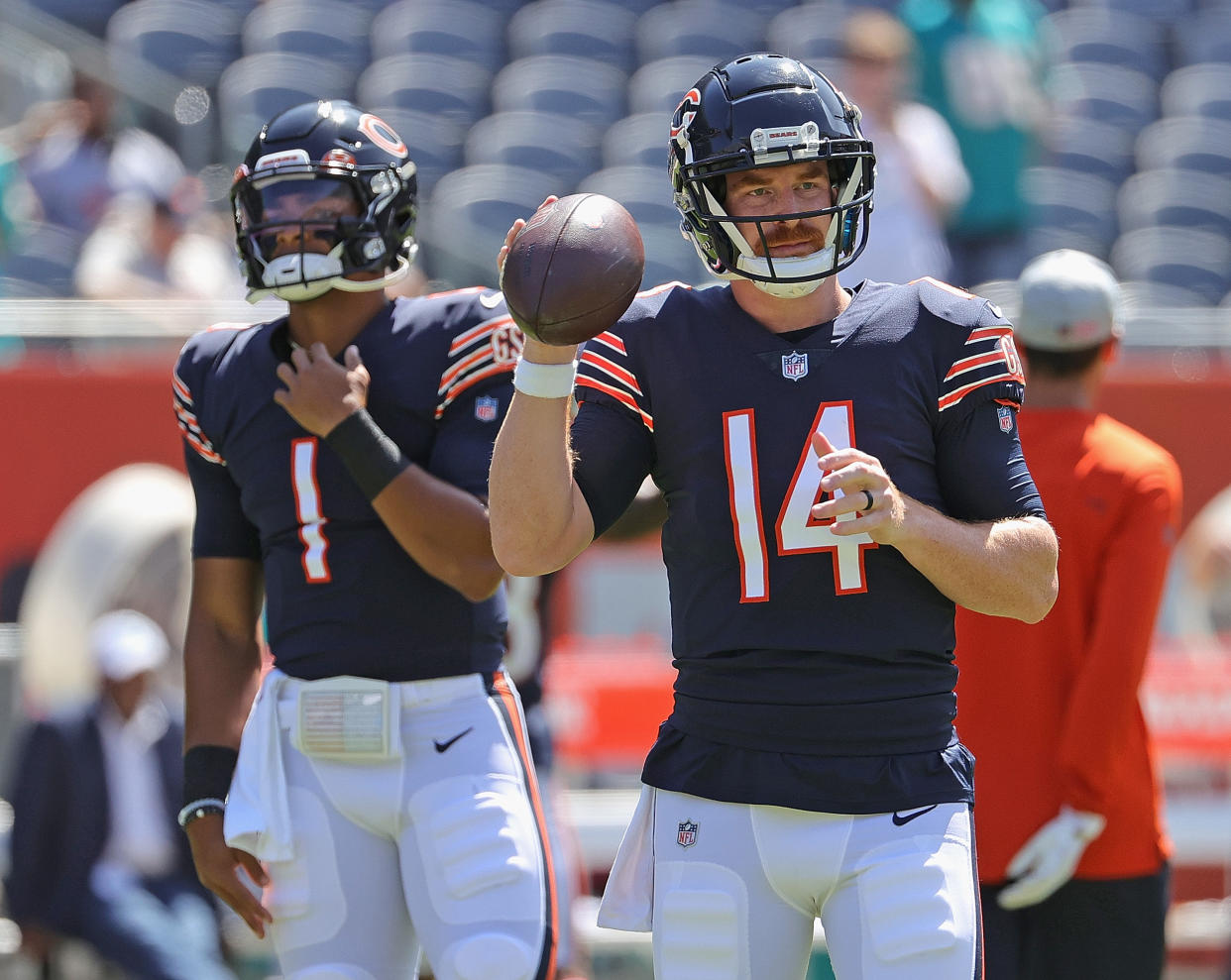 Andy Dalton and Justin Fields before a preseason game.