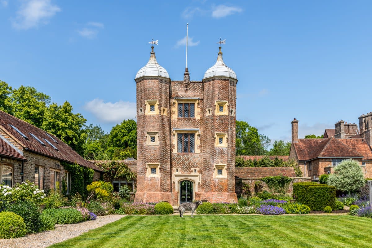 The gatehouse has two octagonal turrets (Hamptons)