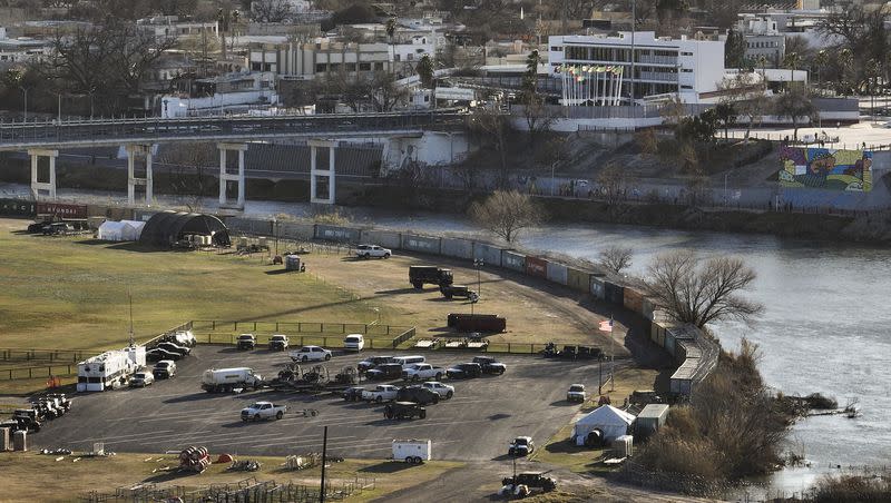 Shipping containers and concertina wire line the banks of the Rio Grande, in Shelby Park in Eagle Pass, Texas, across the border from Piedras Negras, Mexico, on Sunday, Feb. 4, 2024. The same day, Utah Gov. Spencer Cox held a press conference with Tex. Gov. Abbott and other Republican governors.