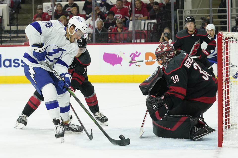 Tampa Bay Lightning center Ross Colton (79) tries to score against Carolina Hurricanes goaltender Alex Nedeljkovic (39) during the third period in Game 5 of an NHL hockey Stanley Cup second-round playoff series in Raleigh, N.C., Tuesday, June 8, 2021. (AP Photo/Gerry Broome)