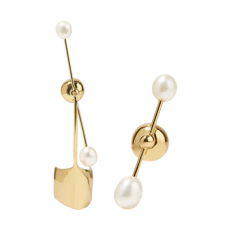 <a rel="nofollow noopener" href="http://rstyle.me/n/csz9r9chdw" target="_blank" data-ylk="slk:Cloud Nine Gold-Plated Pearl Earring, Ellery, $595;elm:context_link;itc:0;sec:content-canvas" class="link ">Cloud Nine Gold-Plated Pearl Earring, Ellery, $595</a>