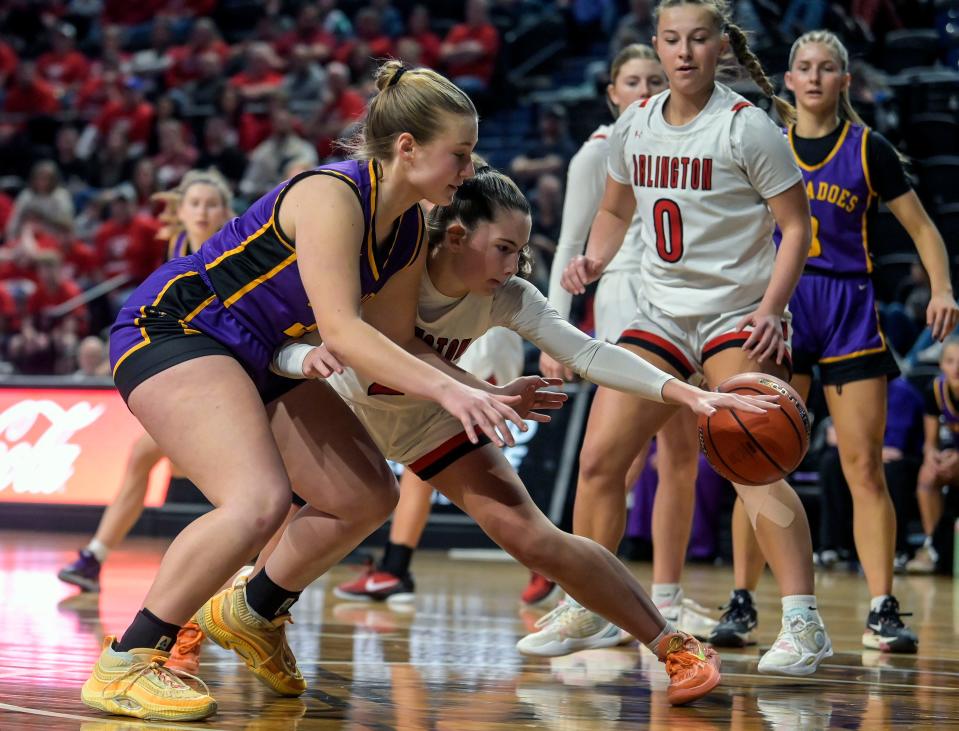 Centerville's Kiylee Westra (45) and Arlington's Jolyssa Steffensen (21) battle for a loose ball during the state B girls basketball championship on Saturday, March 9, 2024 in the Summit Arena at The Monument in Rapid City.