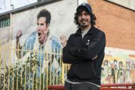 Lionel Messi's childhood friend Diego Vallejos poses outside the primary school they both attended in Rosario, northern Argentina