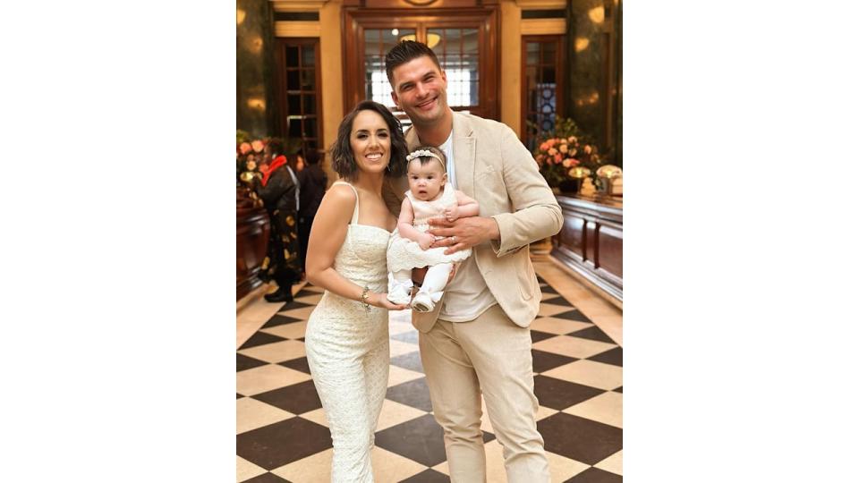 Janette and aljaz holding lyra