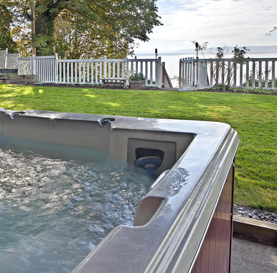 Close up of hot tub in backyard. Photo: Getty