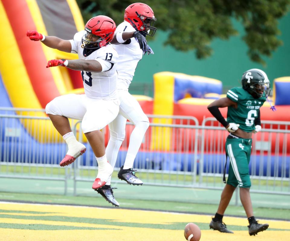 Southfield A&T receiver Lamont Wilcoxson celebrates with Will Skyles Jr. after his touchdown pass against Cass Tech during first half action Saturday, August 26, 2023.