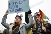 <p>Lydia Macy, 17, left, and Mira Gottlieb, 16, both of Berkeley, Calif., rally outside of the Supreme Court which is hearing the ‘Masterpiece Cakeshop v. Colorado Civil Rights Commission’ today, Tuesday, Dec. 5, 2017, in Washington. (Photo: Jacquelyn Martin/AP) </p>