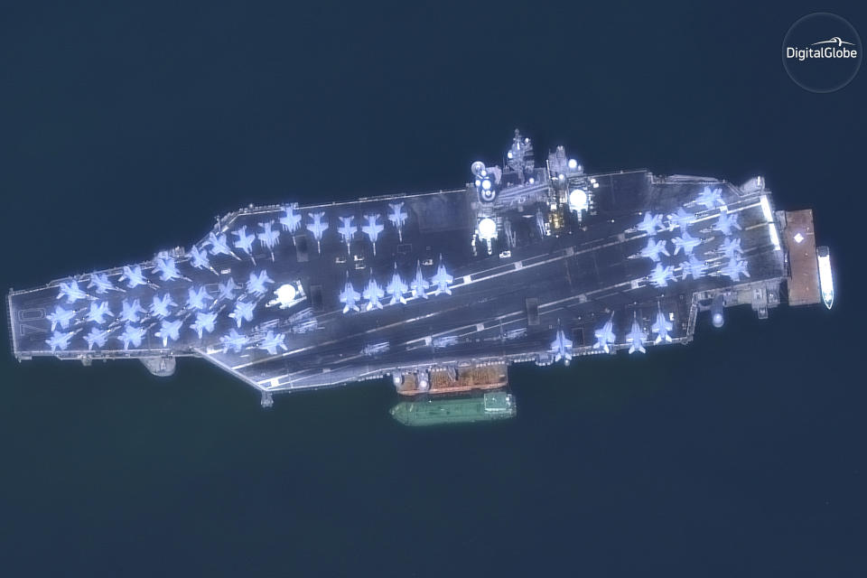 This March 6, 2018 satellite image provided by DigitalGlobe shows The USS Carl Vinson off the coast of Danang, Vietnam. (DigitalGlobe, a Maxar company via AP)