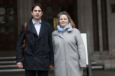 Rebecca Steinfeld (R) and Charles Keidan pose for a photograph outside the Royal Courts of Justice in central London, Britain, February 21, 2017. REUTERS/Stefan Wermuth