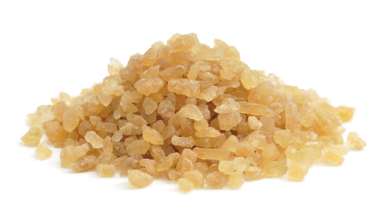 a mound of yellow palm sugar crystals