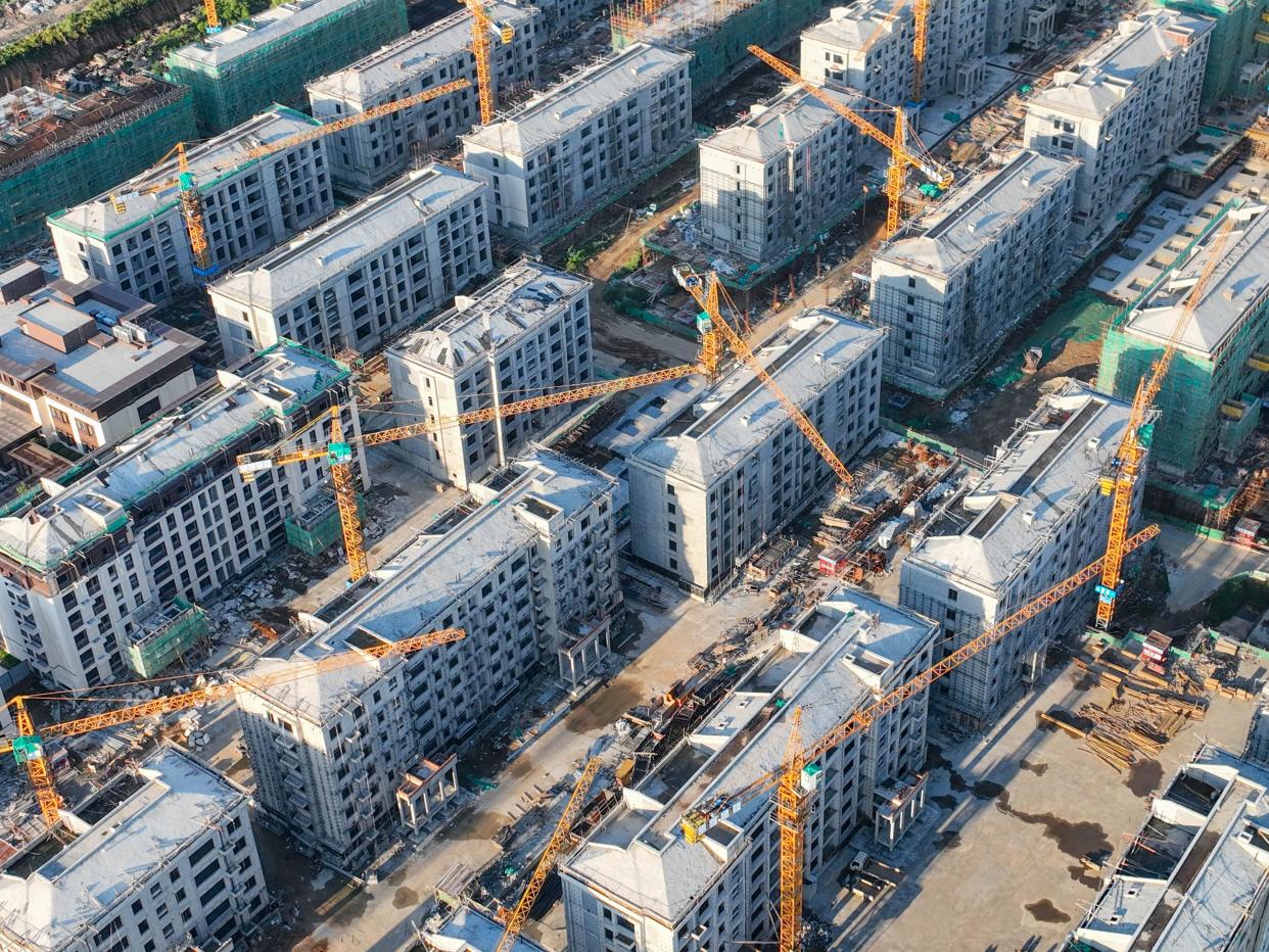 Aerial photo taken on September 15, 2023 shows a commercial residential property under construction in Qingzhou City in August.