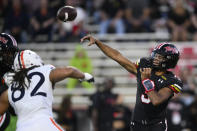 Maryland quarterback Taulia Tagovailoa (3) throws a pass under pressure from Virginia defensive end Kam Butler (82) during the first half of an NCAA college football game Friday, Sept. 15, 2023, in College Park, Md. (AP Photo/Nick Wass)