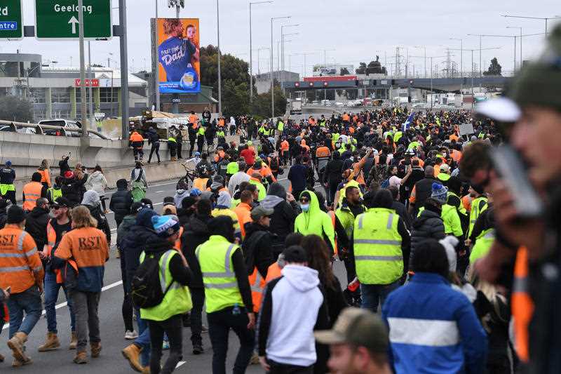 CMFEU construction workers and far right activists are seen protesting on the West Gate Freeway in Melbourne.