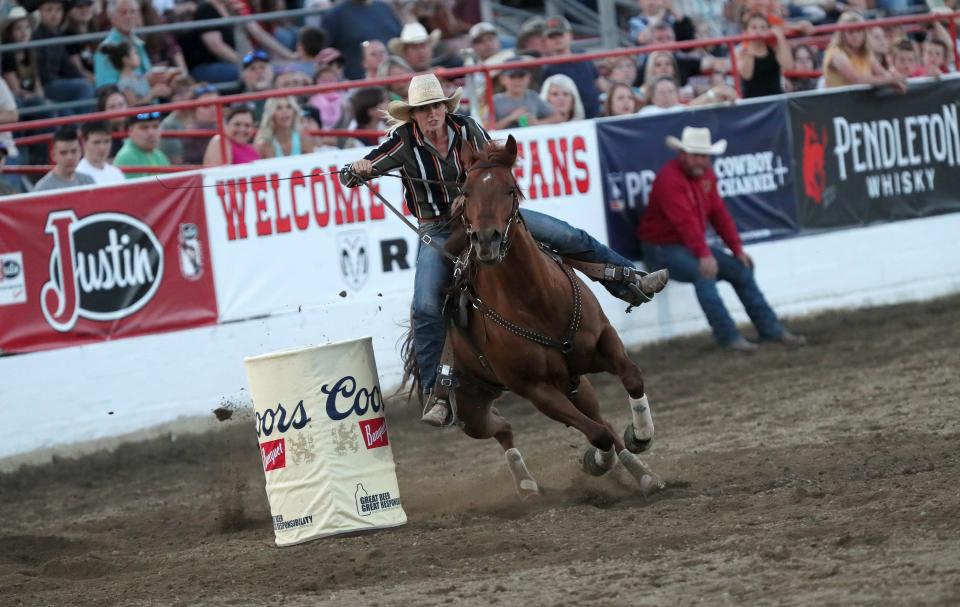 Kaillee Hamre makes a 2nd turn as she competes in the Barrels in the Redding Rodeo on Wednesday evening./// The Extreme Bulls and Barrels kick off the 75th Annual Redding Rodeo on Wednesday May 17th. /// (Photo by Hung T. Vu/Special to the Record Searchlight)