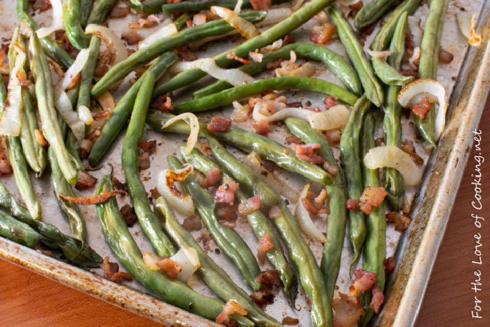 <p>For the Love of Cooking</p><p>Bacon bits and onion elevate this sheet pan green bean recipe. </p><p><strong>Get the recipe: </strong><a href="https://fortheloveofcooking.net/2019/05/roasted-green-beans-with-bacon-and-onion.html" rel="nofollow noopener" target="_blank" data-ylk="slk:Roasted Green Beans with Bacon and Onion;elm:context_link;itc:0;sec:content-canvas" class="link "><strong>Roasted Green Beans with Bacon and Onion</strong></a></p>