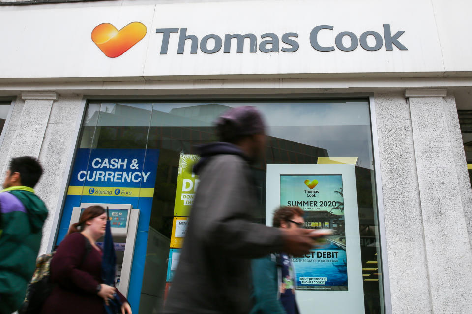 People are seen walking past a Thomas Cook branch in central London. Photo: Dinendra Haria/SOPA Images/LightRocket via Getty Images