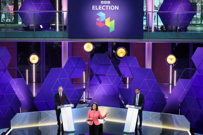 Labour Party leader Keir Starmer (L) and Britain's Prime Minister and Conservative Party leader Rishi Sunak (R) attend a live TV debate, hosted by The BBC, in Nottingham, on June 26, 2024