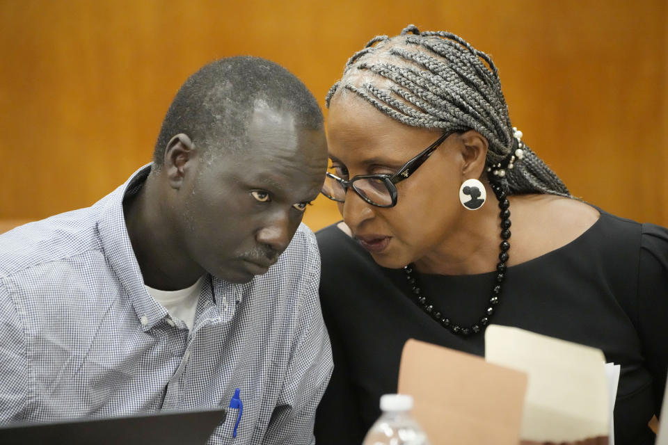 Lisa Ross, right, attorney for Bul Mabil, brother of Dau Mabil, a 33-year-old Jackson, Miss., resident who went missing on March 25 and whose body was found in April floating in the Pearl River in Lawrence County, confer during a hearing, Tuesday, April 30, 2024 in Jackson, Miss. The hearing is on whether a judge should dissolve or modify his injunction preventing the release of Mabil's remains until an independent autopsy could be conducted. (AP Photo/Rogelio V. Solis)