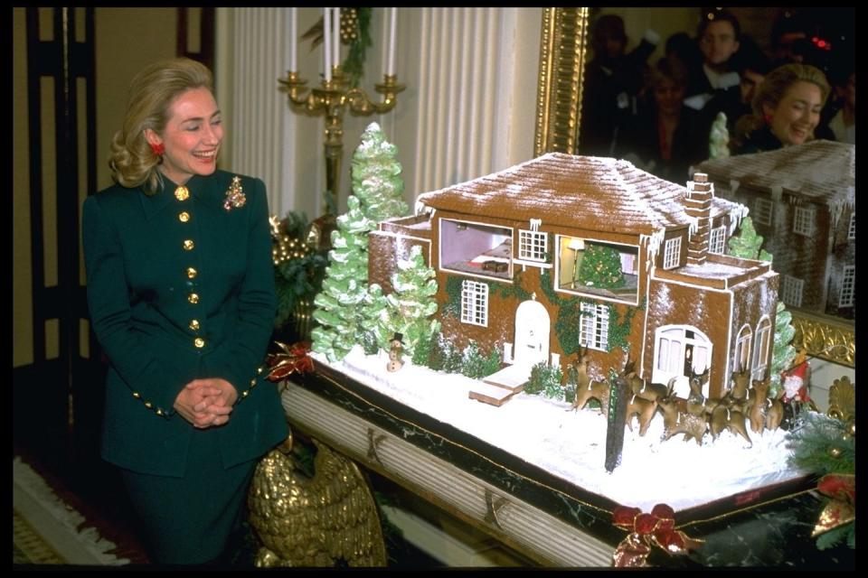 <p>The 1995 decorations for the "Twas the Night Before Christmas, When All Through the House..." theme were donated by architects, needlepointers, embroiderers, culinary schools, and elementary schools. And just like the classic poem, visions of sugar plums danced in their head when the White House pastry chefs created a <a href="https://www.ibiblio.org/pub/archives/whitehouse-papers/1995/Dec/1995-12-04-White-House-Christmas-Theme-Information" rel="nofollow noopener" target="_blank" data-ylk="slk:70-pound gingerbread version;elm:context_link;itc:0;sec:content-canvas" class="link ">70-pound gingerbread version</a> of Hillary's childhood home. </p>