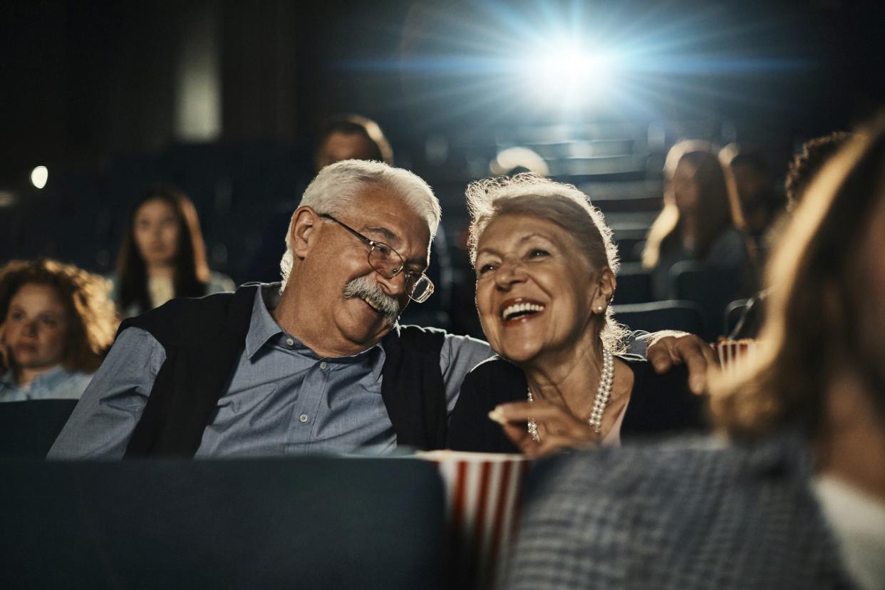 Close up of a senior couple enjoying a movie in the cinema