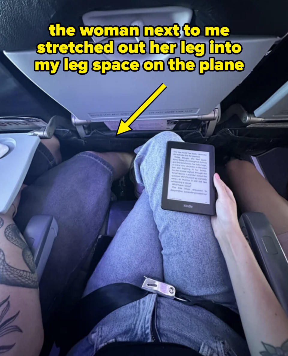 a person's leg infringing on someone else's leg room on a plane