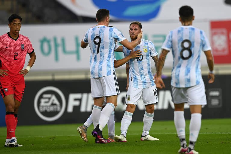 Argentina's Alexis Mac Allister (2nd R) celebrates his goal with his teammates against South Korea during their friendly football match in Yongin on July 13, 2021, ahead of the 2020 Tokyo Olympic Games. (Photo by Jung Yeon-je / AFP)