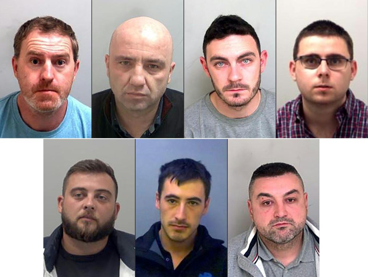 (COMBO) This combination of handout pictures created on January 22, 2021, and released by Essex Police, shows top row LtoR: ringleaders Ronan Hughes and Gheorghe Nica, and truck drivers Maurice Robinson and Eamonn Harrison, and botom row LtoR: Ovidiu Hanga, Christopher Kennedy, Valentin Colota, who were all sentenced to prison for their part in a people smuggling plot that led to the death of 39 Vietnamese migrants. - A British judge on Friday handed down sentences of 27 and 20 years to the ringleaders of a people smuggling plot that led to the death of 39 Vietnamese migrants in horrific conditions in the back of a lorry. The 39 -- the youngest of whom were two 15-year-old boys -- suffocated in the container as they were being transported to what they had hoped would be new lives in Britain. The lifeless bodies of the migrants were discovered inside the sealed unit at a port near London in October, 2019. (Photos by - / various sources / AFP) (Photo by -/THAMES VALLEY POLICE/AFP via Getty Images)