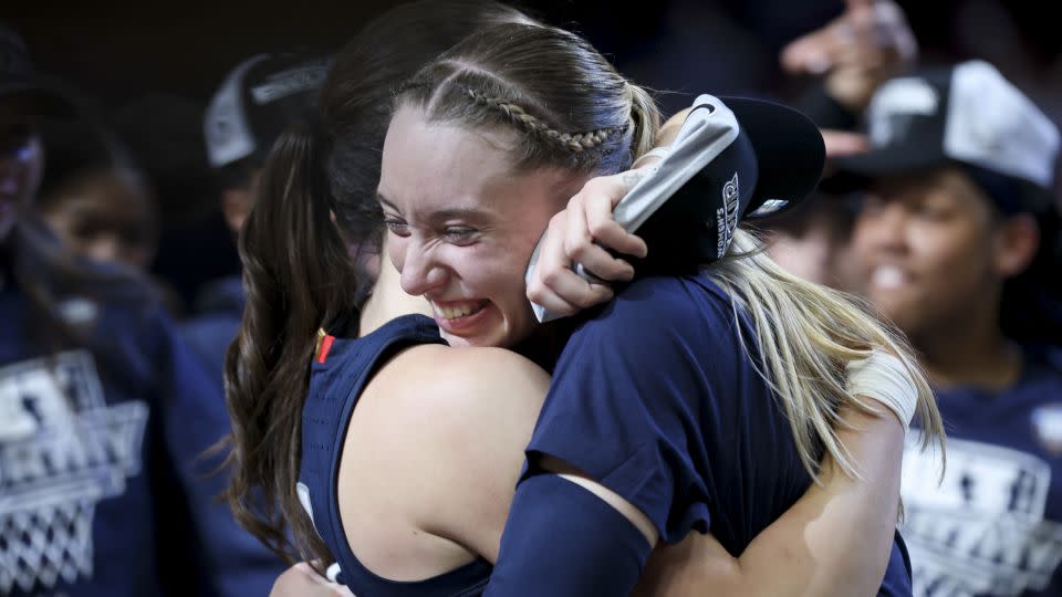 Bueckers and Nika Muhl hug after UConn's victory over USC in the Elite Eight round. - Steph Chambers/Getty Images