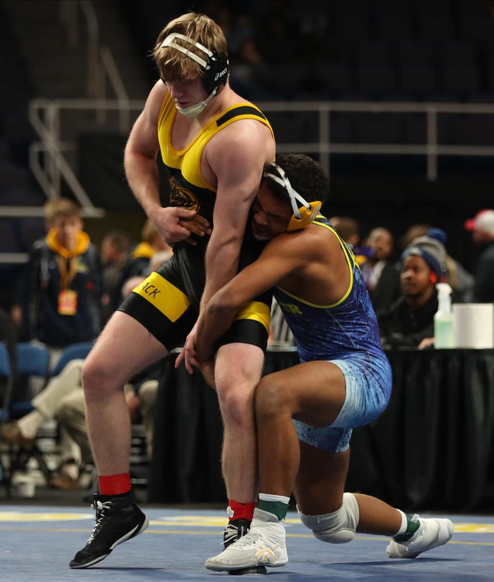 Windsor's Gabriel Monroe works to escape the grasp of Central Valley Academy's Ethan Randall (right) during the 189-pound championship bout at the NYSPHSAA wrestling championships Saturday in Albany.