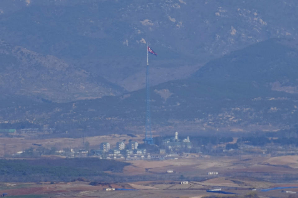 A North Korean flag flutters in the wind atop a 160-meter tower in North Korea's village Gijungdong, as seen from the unification observatory in Paju, South Korea, Friday, April 15, 2022. North Korea is marking a key state anniversary Friday with calls for stronger loyalty to leader Kim Jong Un, but there was no word on an expected military parade to display new weapons amid heightened animosities with the United States. (AP Photo/Lee Jin-man)