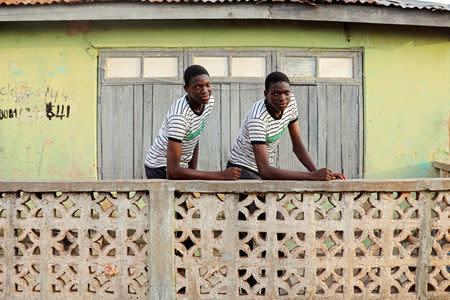 Identical twins Kehinde and Taiwo Kolawole pose in Igbo Ora town, Oyo State, Nigeria April 4, 2019. Picture taken April 4, 2019. REUTERS/Afolabi Sotunde