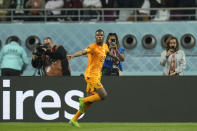 Denzel Dumfries of the Netherlands celebrates after scoring his side's 3rd goal during the World Cup round of 16 soccer match between the Netherlands and the United States, at the Khalifa International Stadium in Doha, Qatar, Saturday, Dec. 3, 2022. (AP Photo/Francisco Seco)