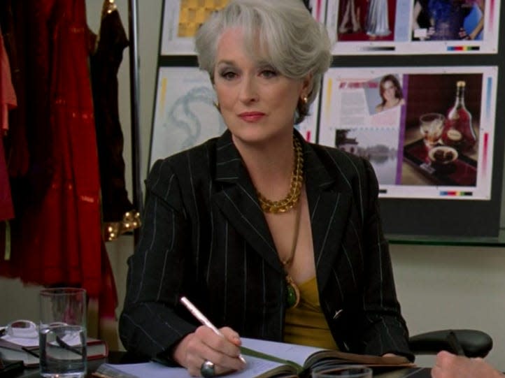 meryl streep as miranda in devil wears prada sitting at her desk