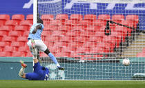 Chelsea's Hakim Ziyech, bottom, scores his side's opening goal during the English FA Cup semifinal soccer match between Chelsea and Manchester City at Wembley Stadium in London, England, Saturday, April 17, 2021. (Ben Stansall, Pool via AP)