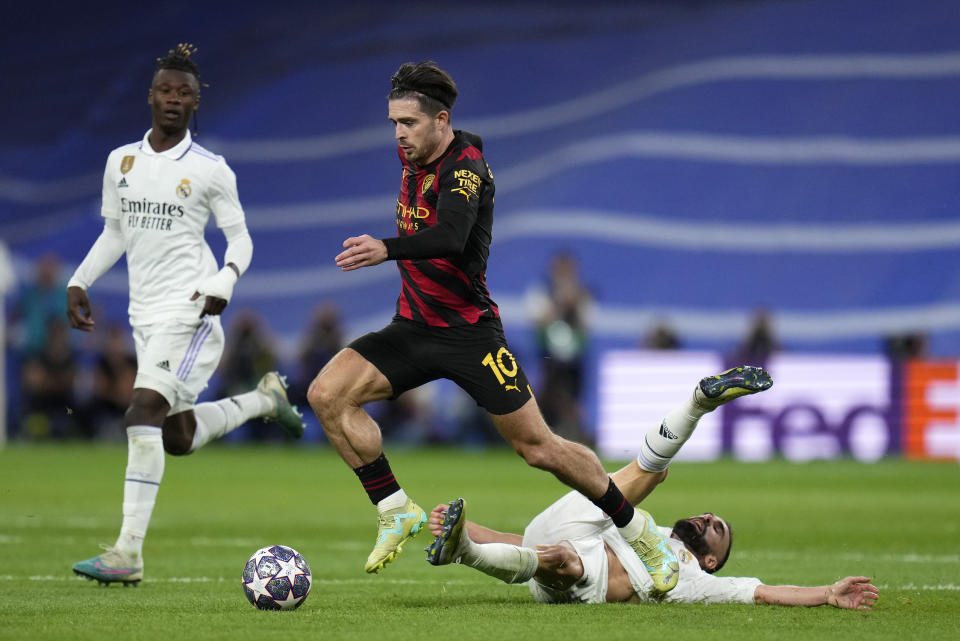 Manchester City's Jack Grealish runs with the ball during the Champions League semifinal first leg soccer match between Real Madrid and Manchester City at the Santiago Bernabeu stadium in Madrid, Spain, Tuesday, May 9, 2023. (AP Photo/Manu Fernandez)