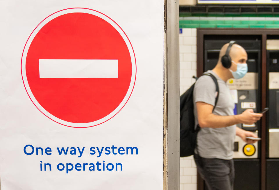 A one way system sign at Clapham Common underground station, London, as train services increase this week as part of the easing of coronavirus lockdown restrictions.