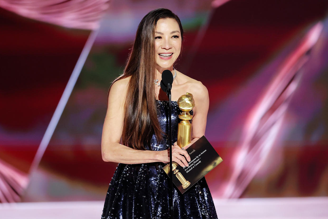 Image: Michelle Yeoh accepts the Best Actress in a Motion Picture  Musical or Comedy award for 