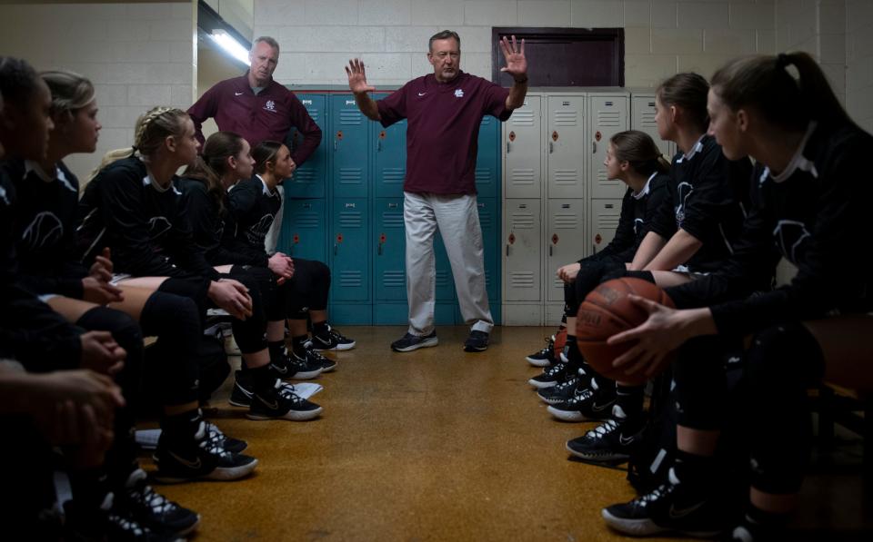 Henderson County Assistant Coach Phil Gibson, center, talks to the team before the Second Region Tournament championship at Madisonville-North Hopkins High School in Madisonville, Ky., Friday, March 4, 2022. The Henderson County Lady Colonels won the championship 53-33 against the Webster County Lady Trojans. 