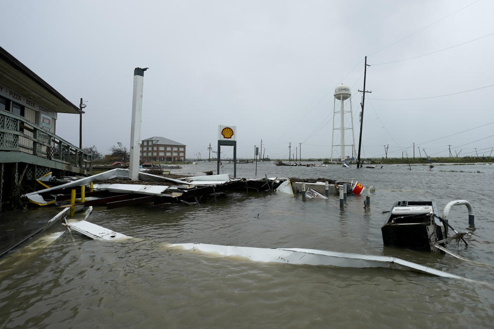 Flooding surrounds a damaged building Friday, Aug. 28, 2020, in Cameron, La., after Hurricane Laura moved through the area Thursday. (AP Photo/David J. Phillip)