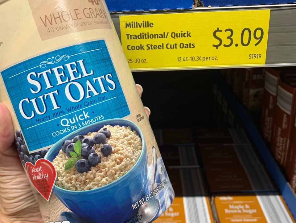 hand holding package of steel cut oats at aldi