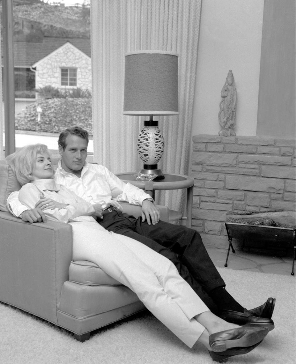 The happily married Paul Newman and Joanne Woodward, Easterners by preference, dream of summer home in Connecticut and Manhattan relax in their rented Beverly Hills home.