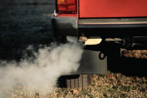 Smoke Coming from Exhaust Pipe of a Car