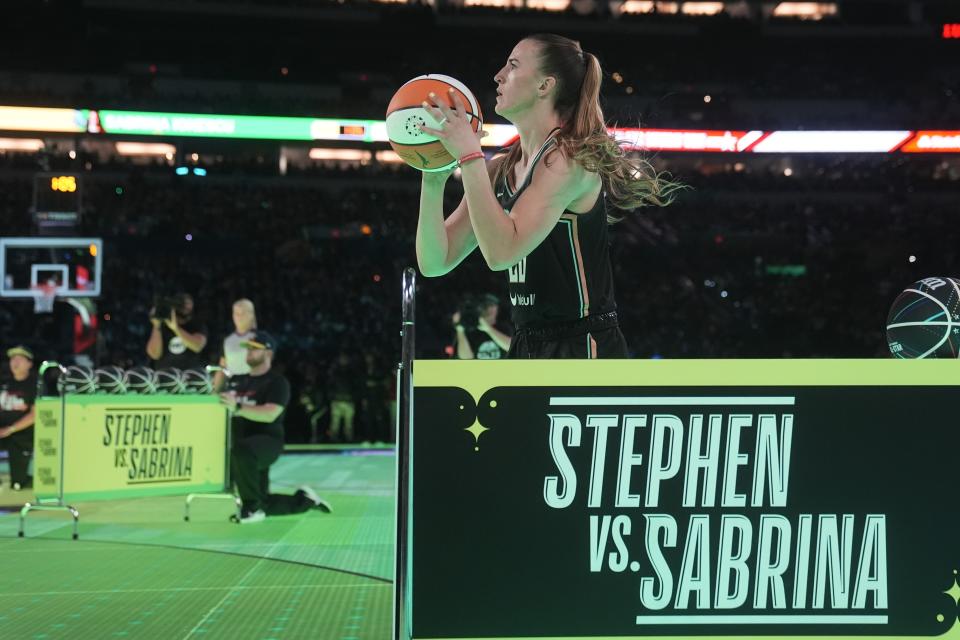 New York Liberty guard Sabrina Ionescu shoots during a competition against Golden State Warriors' Stephen Curry at the NBA basketball All-Star weekend, Saturday, Feb. 17, 2024, in Indianapolis. (AP Photo/Darron Cummings)