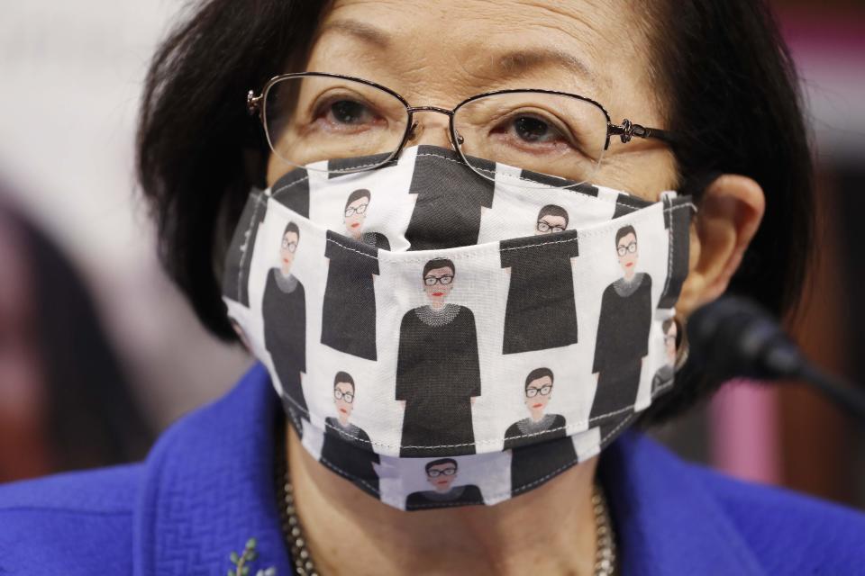 Sen. Mazie Hirono, D-Hawaii, wears a mask showing former Supreme Court Justice Ruth Bader Gnnsburg as Supreme Court nominee Judge Amy Coney Barrett participates in her confirmation hearing before the Senate Judiciary Committee on Monday.