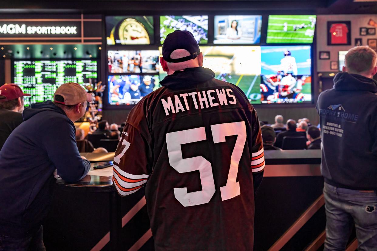 A Browns fan sports a Clay Matthews jersey as he watches the team Sunday at MGM Northfield Park’s BetMGM Sportsbook & Lounge.