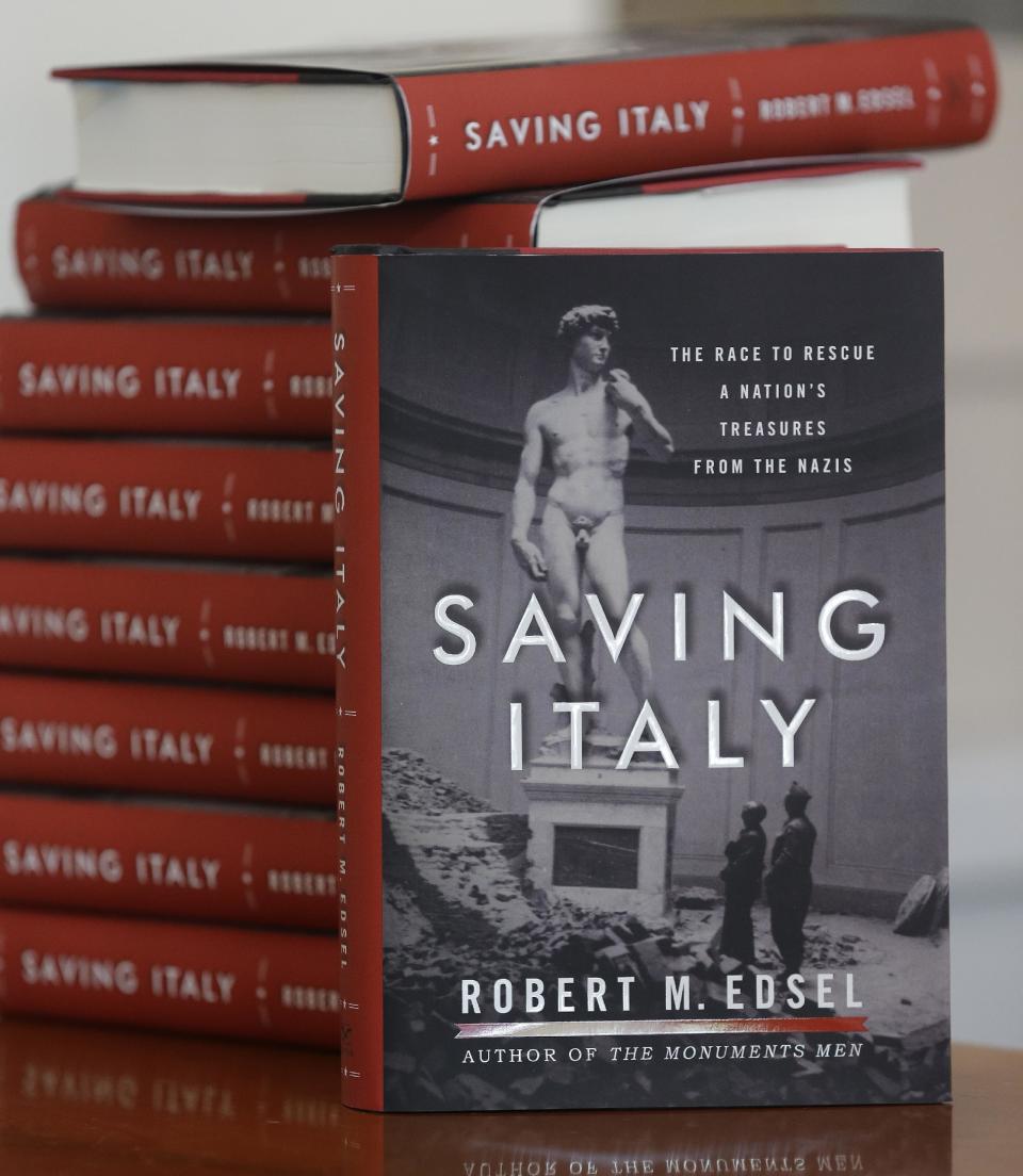 This photo taken April 29, 2013 shows copies of the book titled Saving Italy by Robert Edsel, founder of the Monuments Men Foundation for the Preservation of Art, in Dallas. Edsel started his foundation in 2007 to honor and continue the work of the Monuments Men, the roughly 345 men and women from 13 nations who helped protect cultural treasures during World War II. (AP Photo/LM Otero)