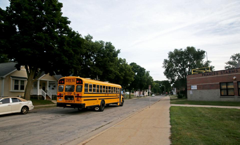 A school bus passes by Starms Discovery Learning Center at 2035 N. 25th St. on  Aug. 15, 2022.