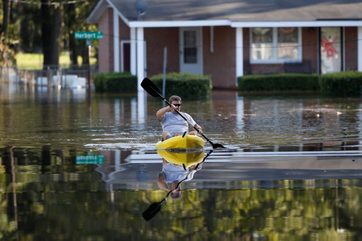 Parker Uzzell checks on his property with a kayak after the effects from Hurricane Matthew in Goldsboro, N.C., on Oct. 12, 2016. (Photo: Randall Hill/Reuters)